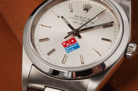 domino's rolex logo